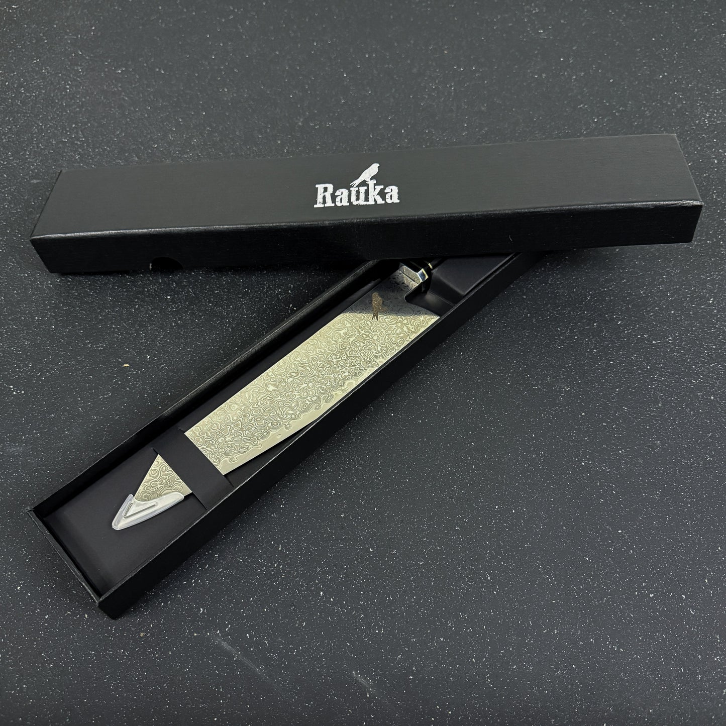 Cuchillo japonés Kiritsuke Rauka Kiru de acero Damasco con mango de ébano, diseñado para cortes elegantes y precisos