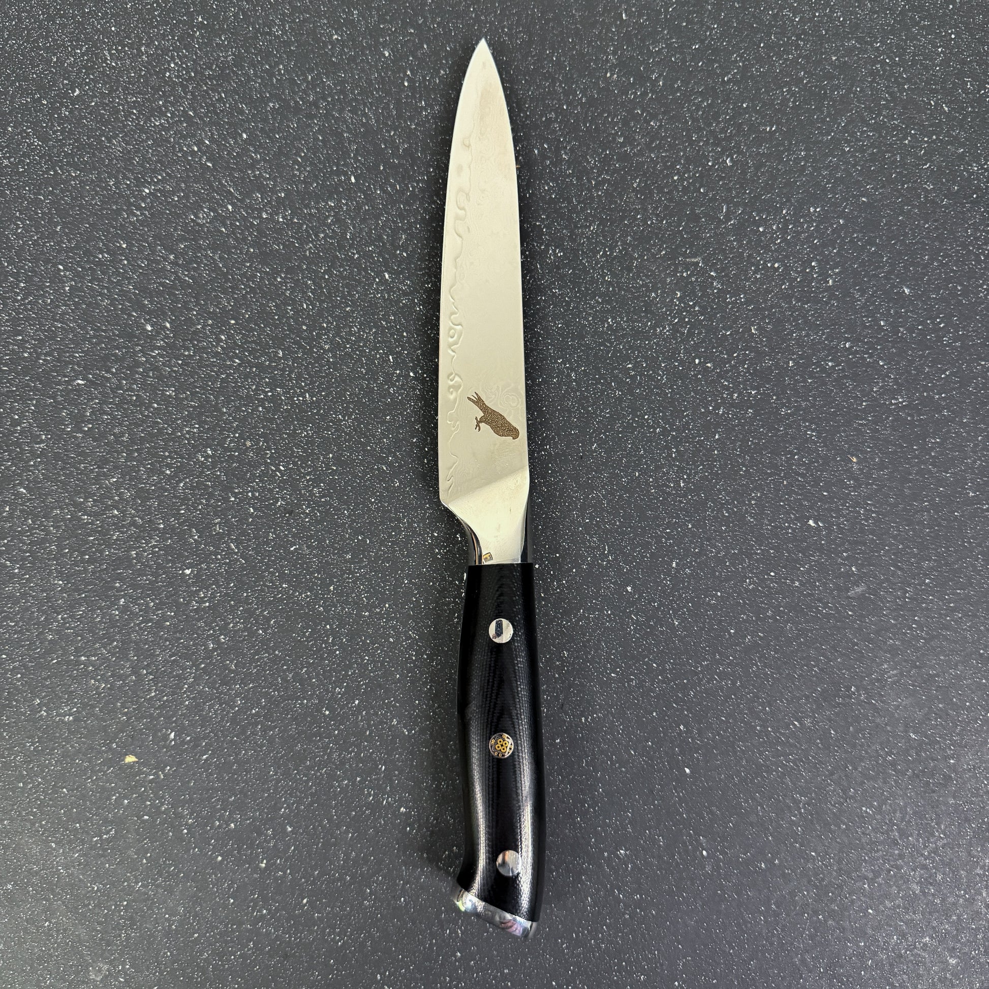 Cuchillo Utility Rauka Reclus con hoja de acero Damasco y mango G10, ideal para tareas precisas en cocina