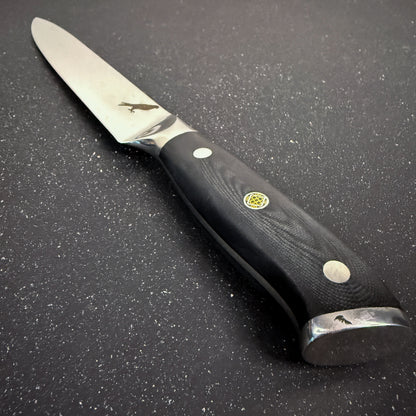 Cuchillo Carving Rauka Cay con hoja de acero Damasco y mango G10, ideal para cortes largos y precisos en cocina
