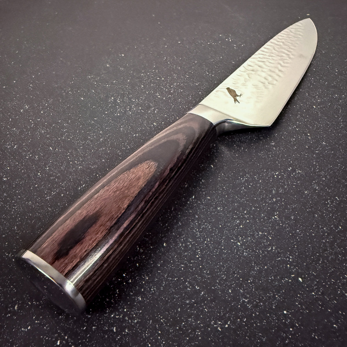 Detalle del mango de cuchillo parrillero de acero inoxidable 33 cm Condor Rauka