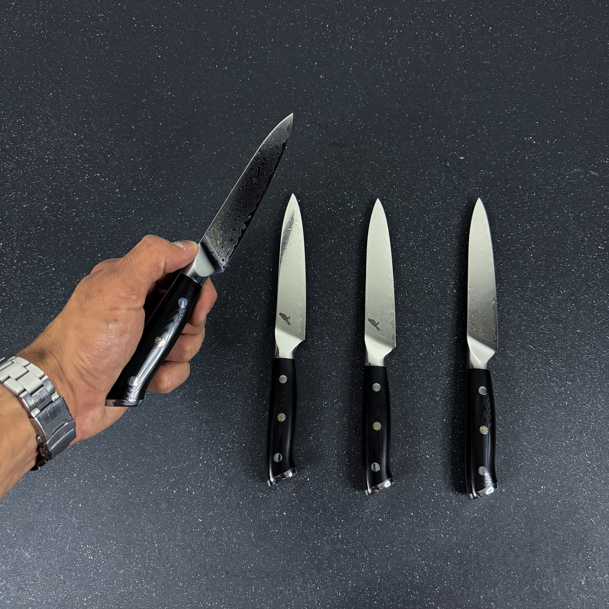 Detalle de set de 4 cuchillos de mesa de acero damasco 24 cm Reclus Rauka