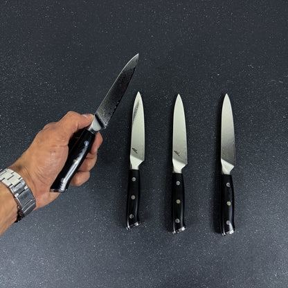 Detalle de set de 4 cuchillos de mesa de acero damasco 24 cm Reclus Rauka